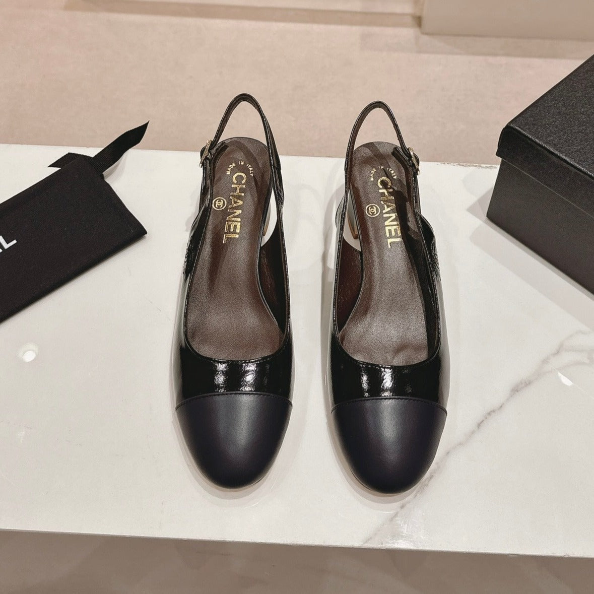 CHANEL SLINGBACKS IN BLACK SHEEPSKIN